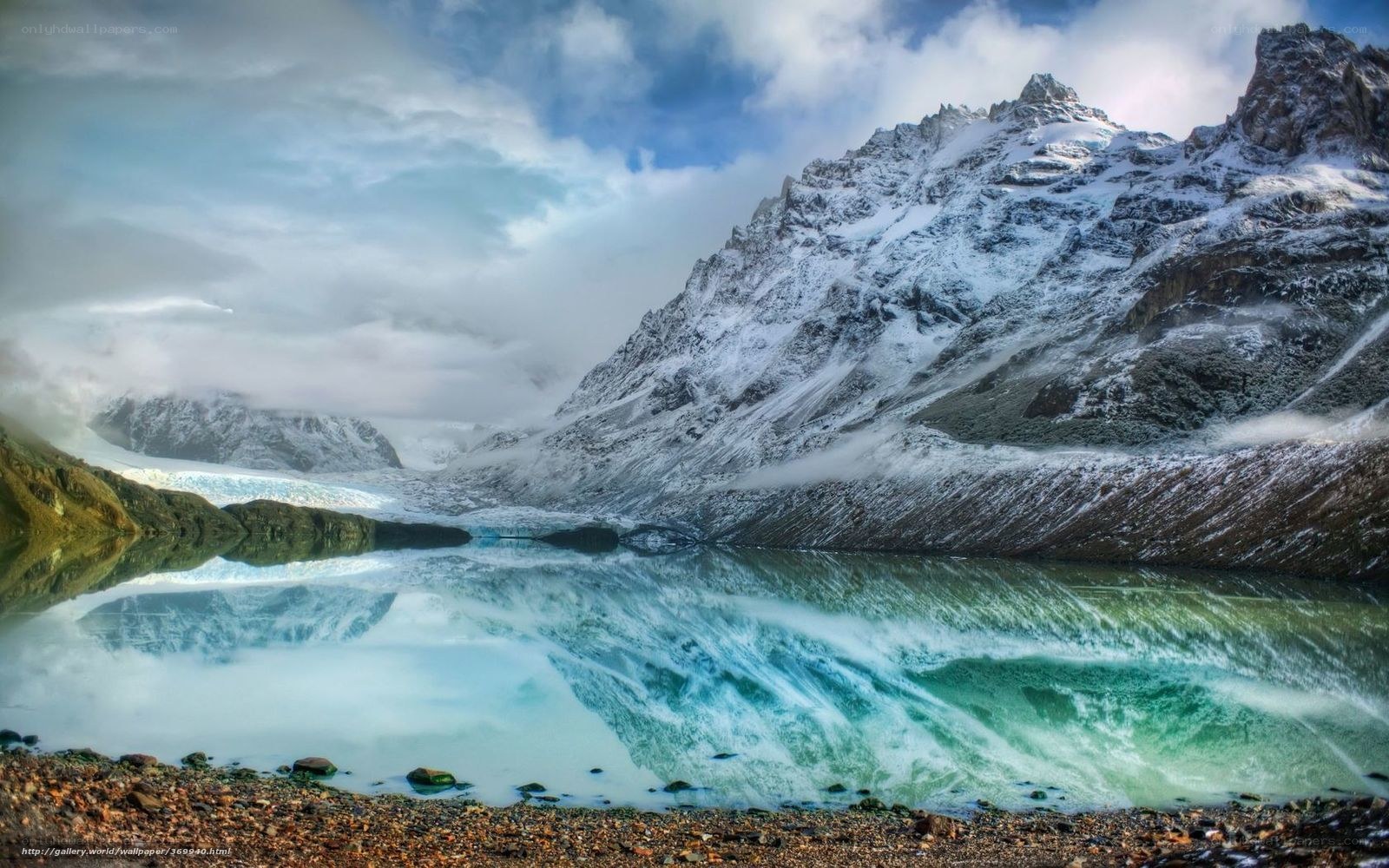 Snowy mountain lake reflection