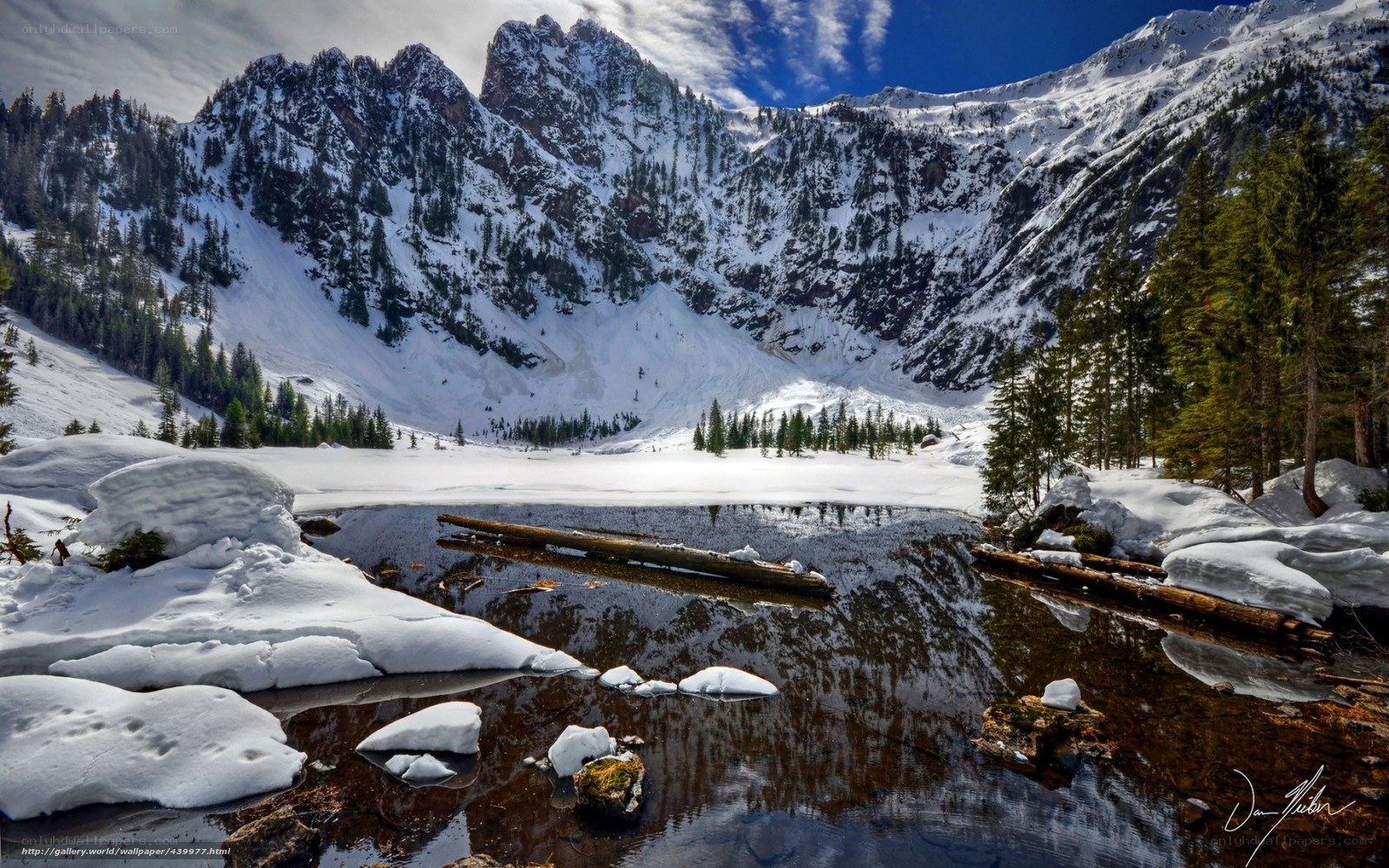 Snowy mountain lake reflection