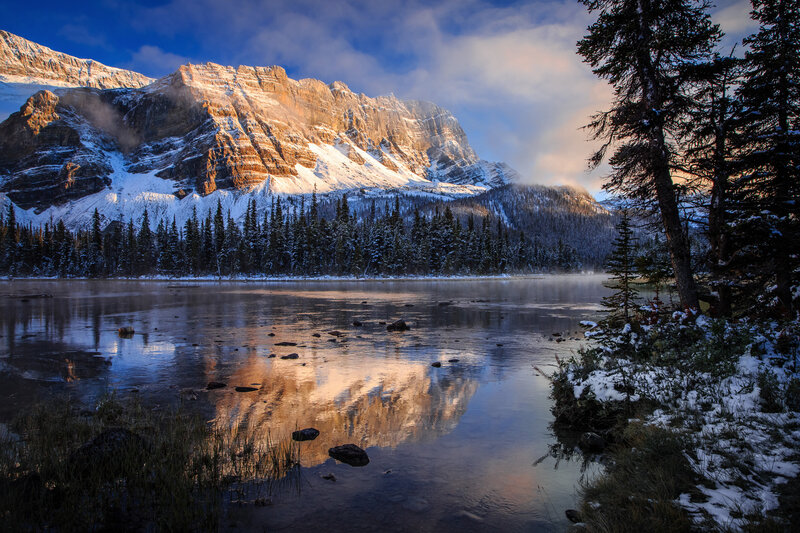 Snowy mountain lake reflection