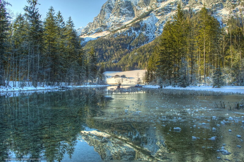 Snowy mountain lake reflection