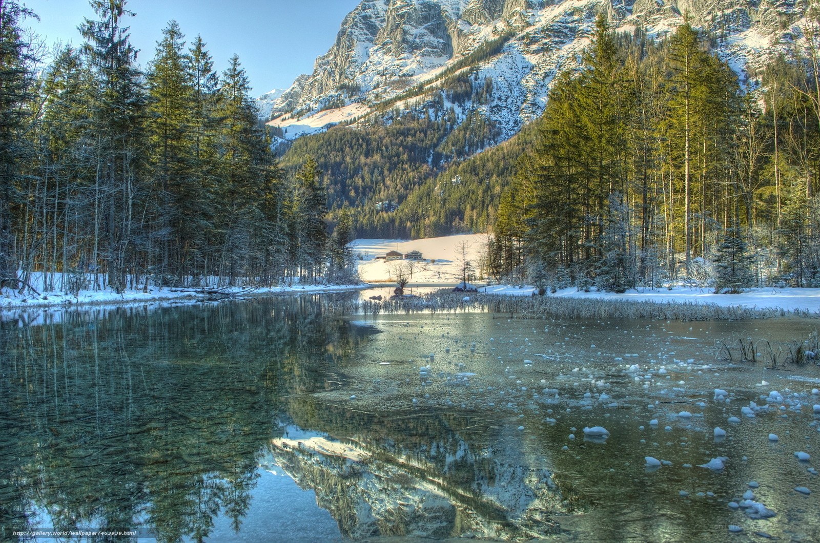 Snowy mountain lake reflection