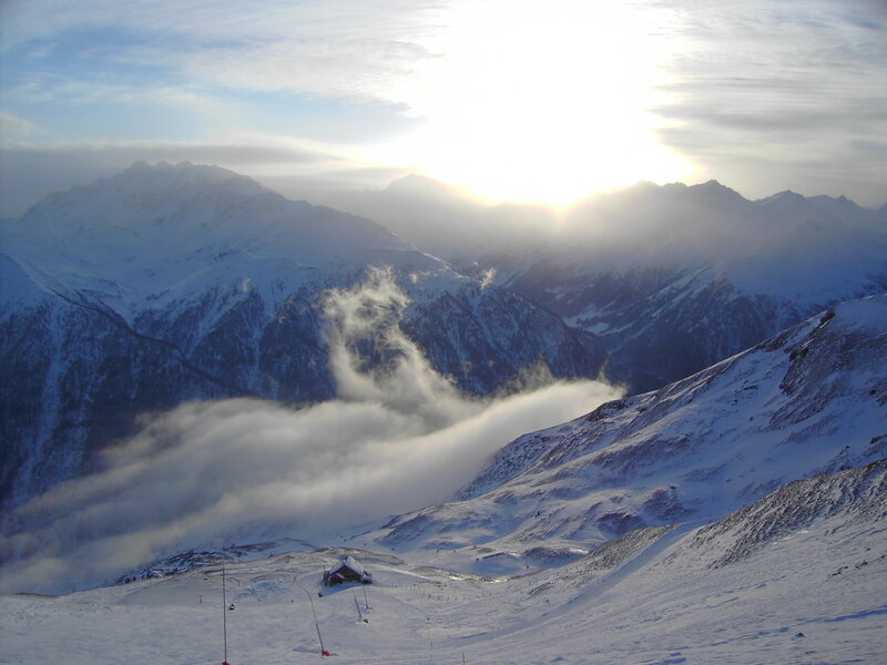 Snowy mountain landscape at sunrise
