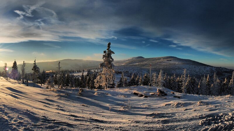 Snowy mountain landscape at sunrise