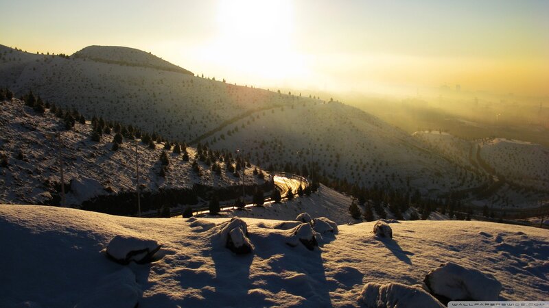 Snowy mountain landscape at sunrise