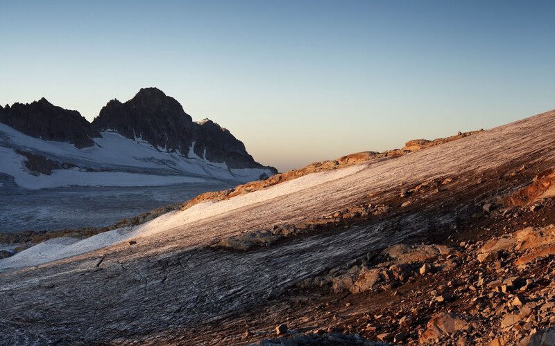 Snowy mountain landscape at sunrise