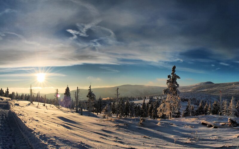 Snowy mountain landscape at sunrise