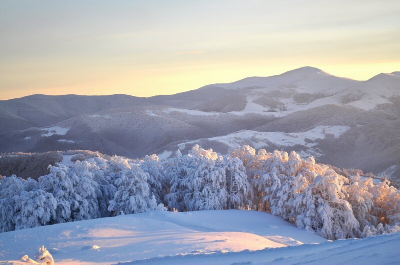 Snowy mountain landscape at sunrise
