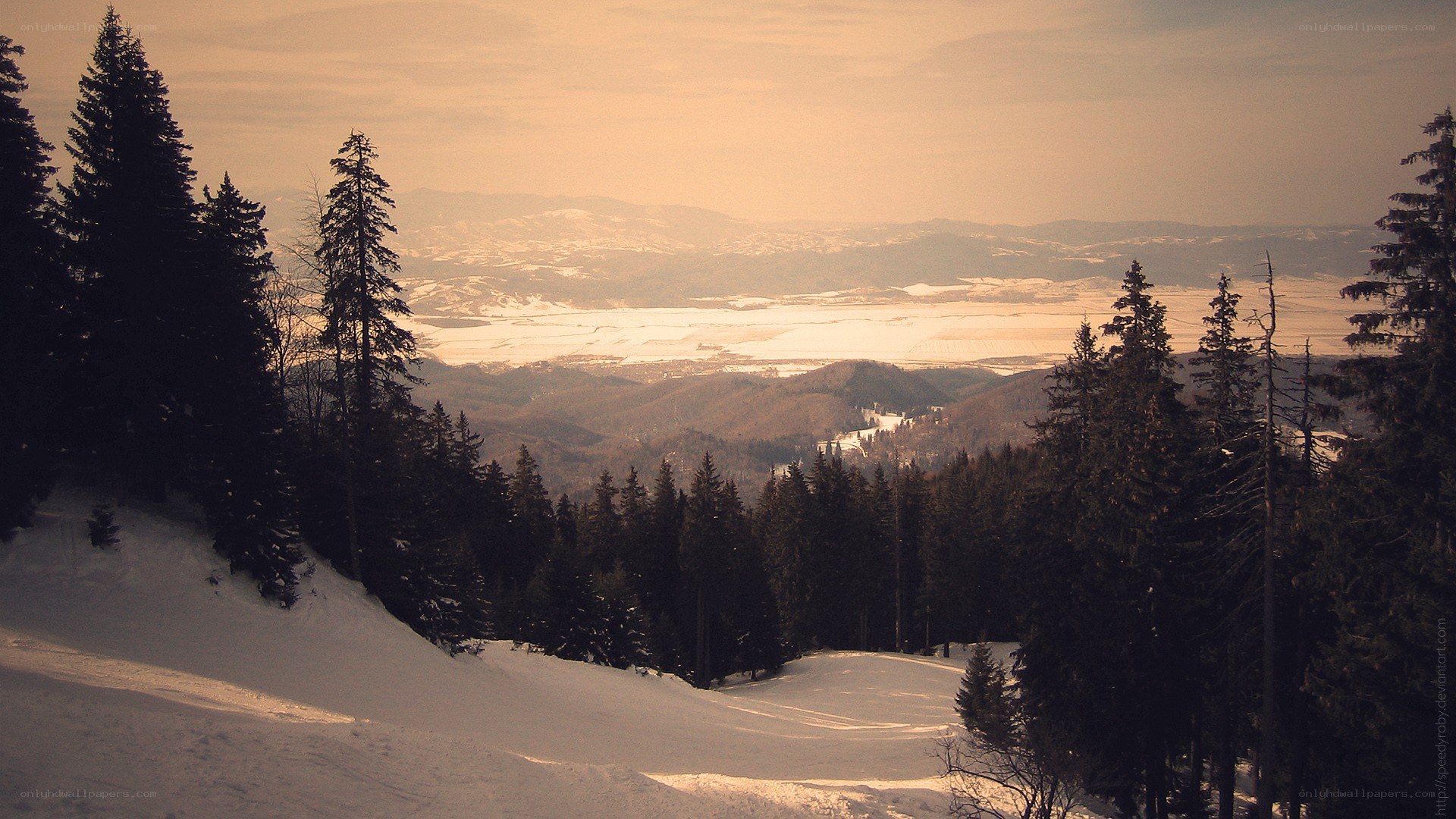 Snowy mountain landscape at sunset