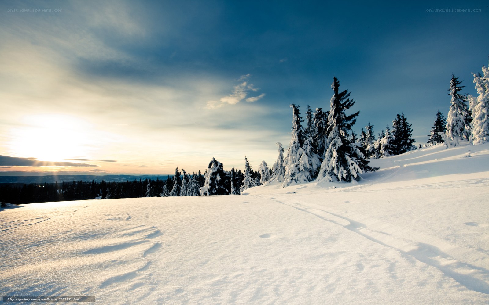 Snowy mountain landscape at sunset