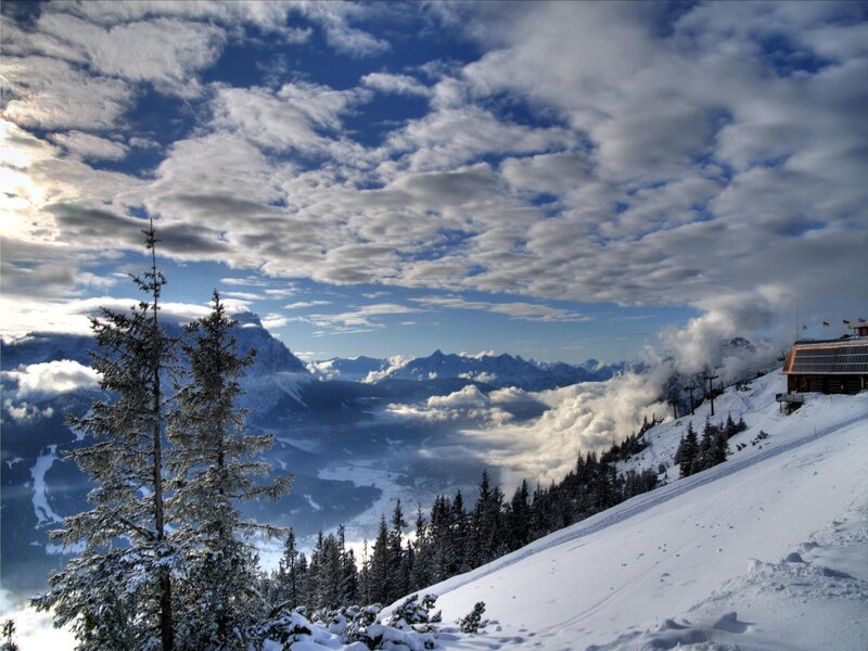 Snowy mountain landscape with clouds