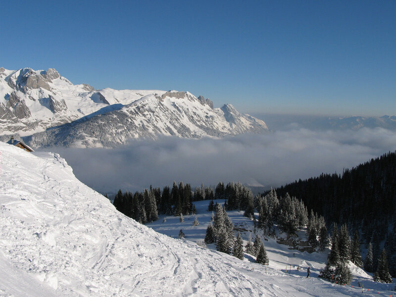Snowy mountain landscape with clouds