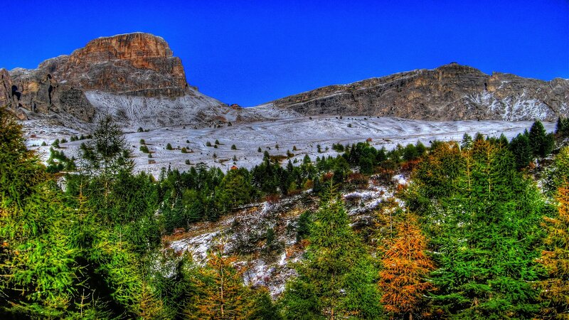 Snowy mountain landscape with forest