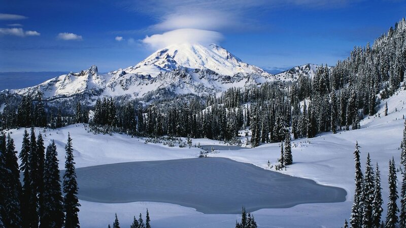 Snowy mountain landscape with frozen lake
