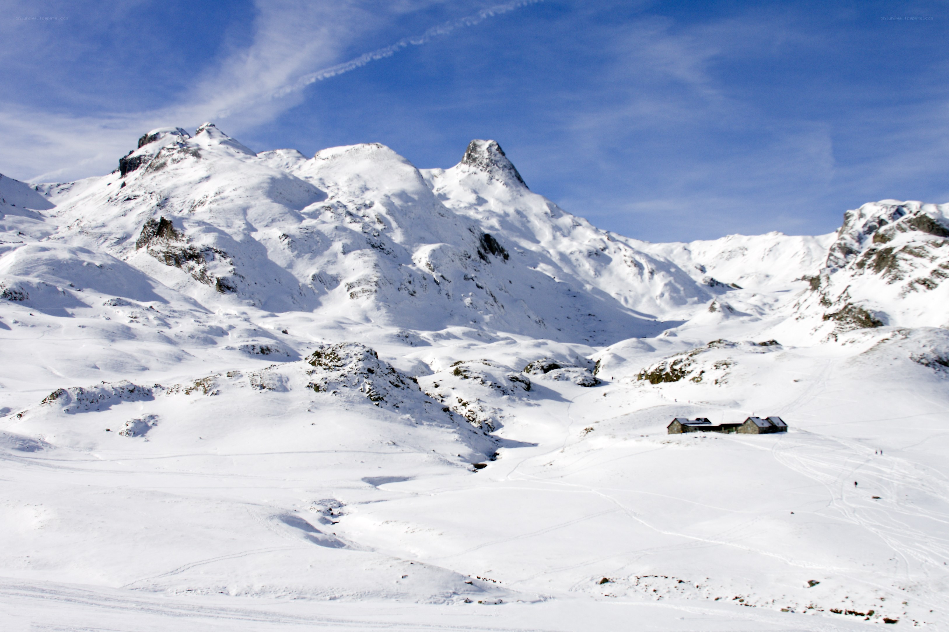 Snowy mountain landscape with huts