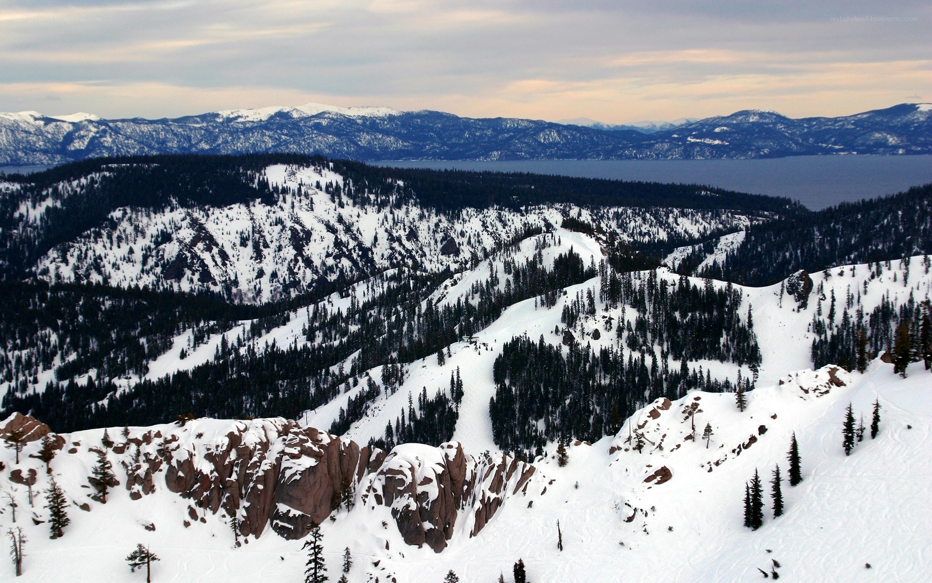 Snowy mountain landscape with lake