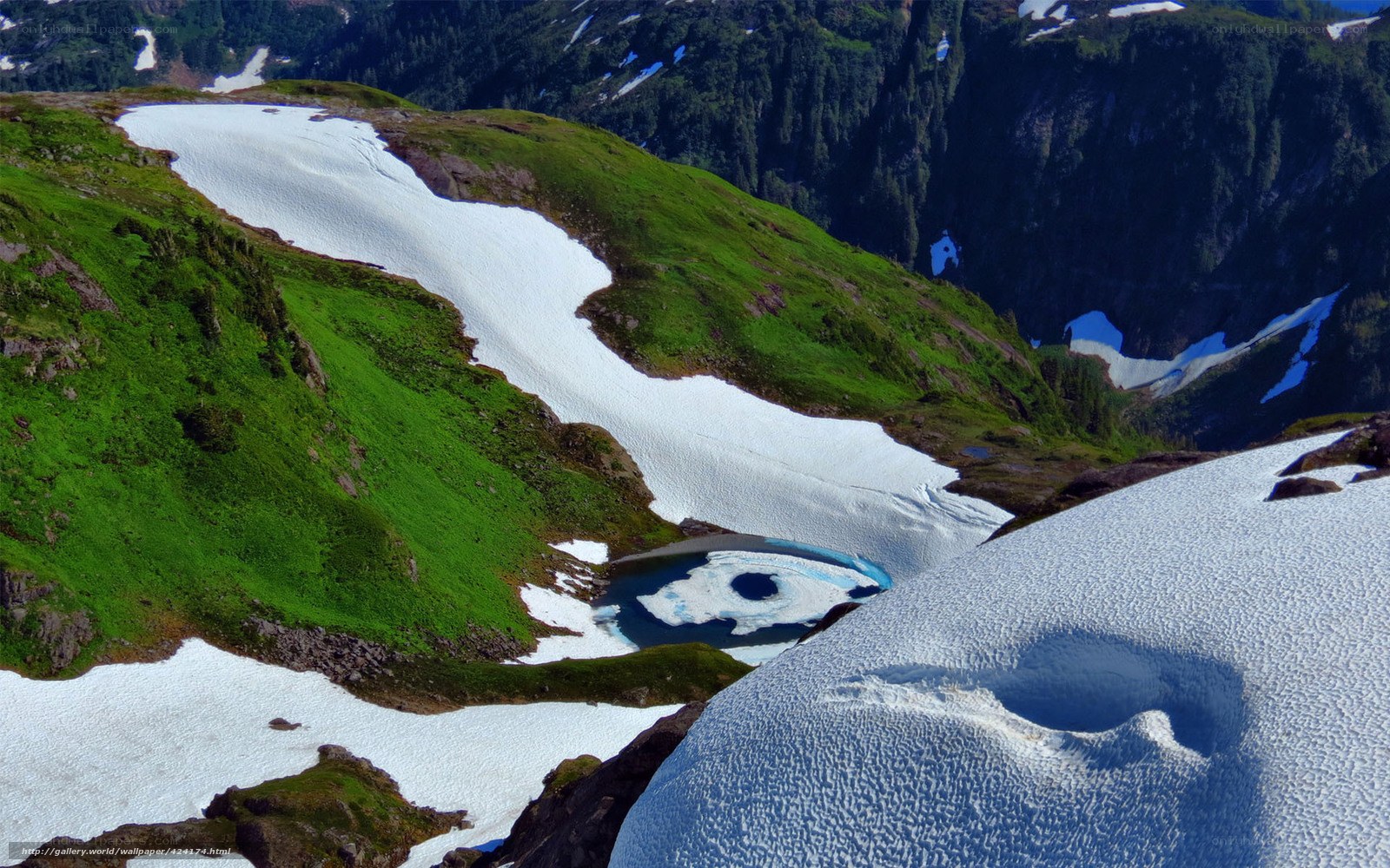 Snowy mountain landscape with lake