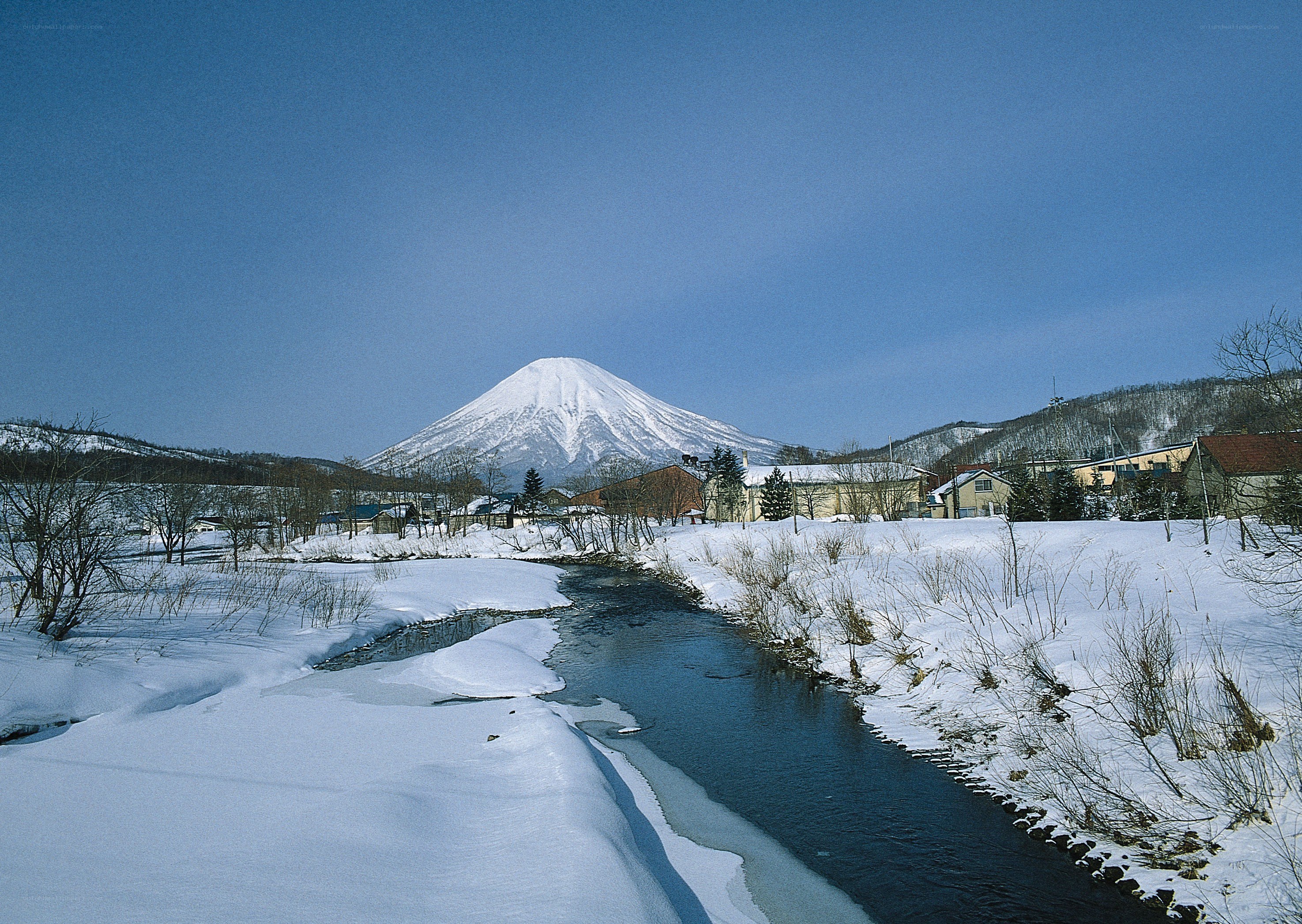 Snowy mountain landscape with river
