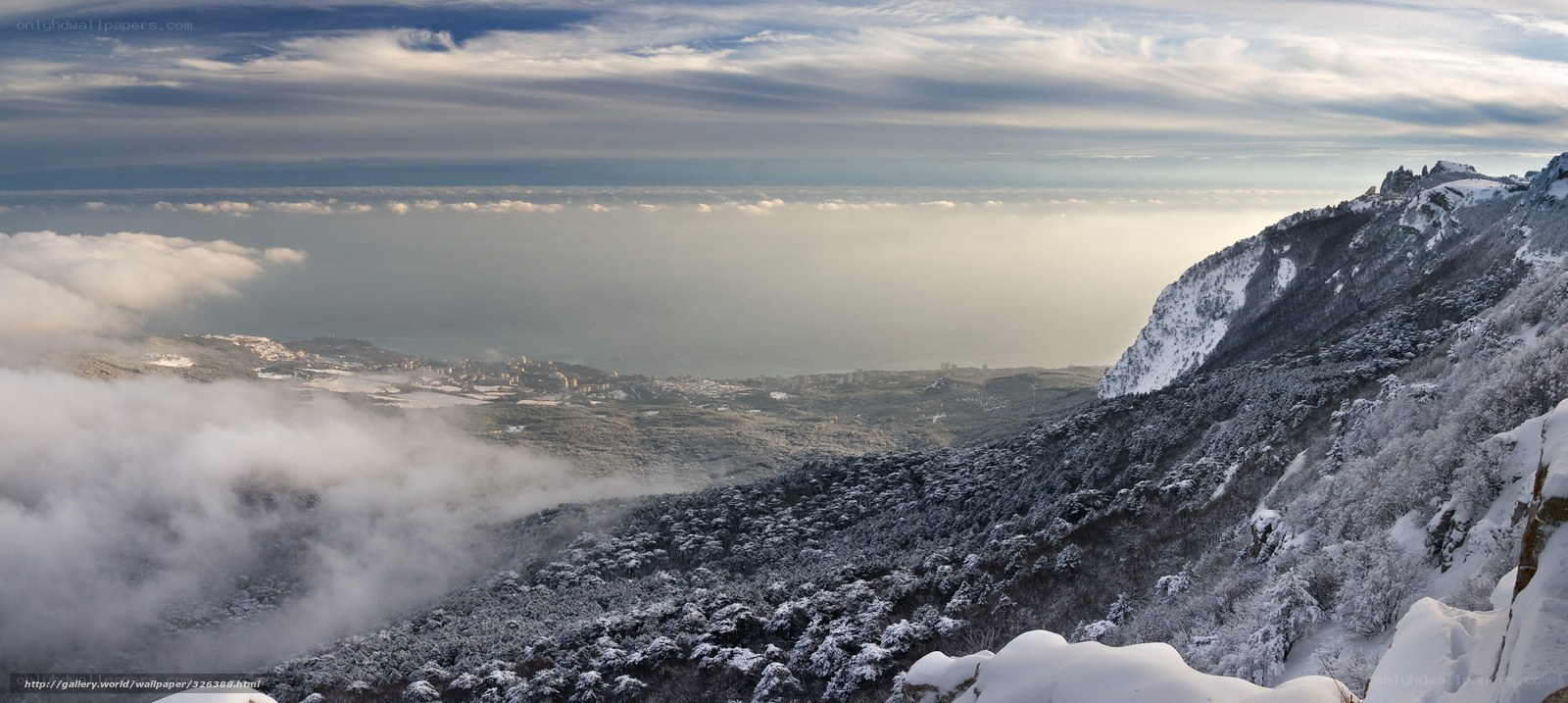 Snowy mountain landscape with sea view