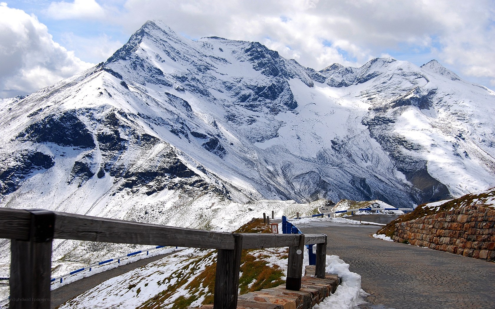 Snowy mountain pass with road
