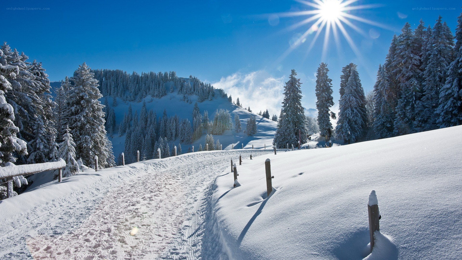 Snowy mountain path at sunrise