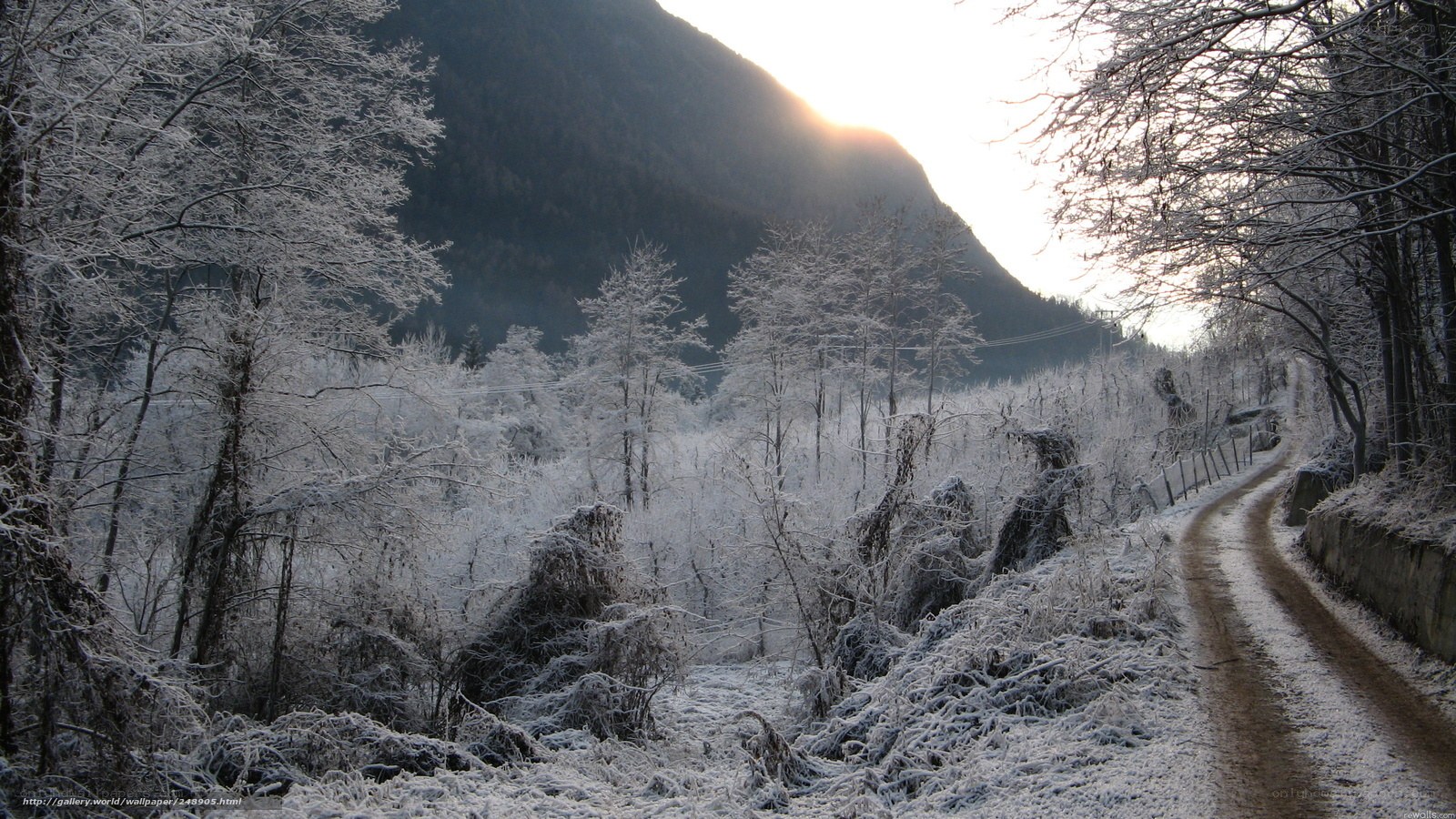 Snowy mountain path at sunrise