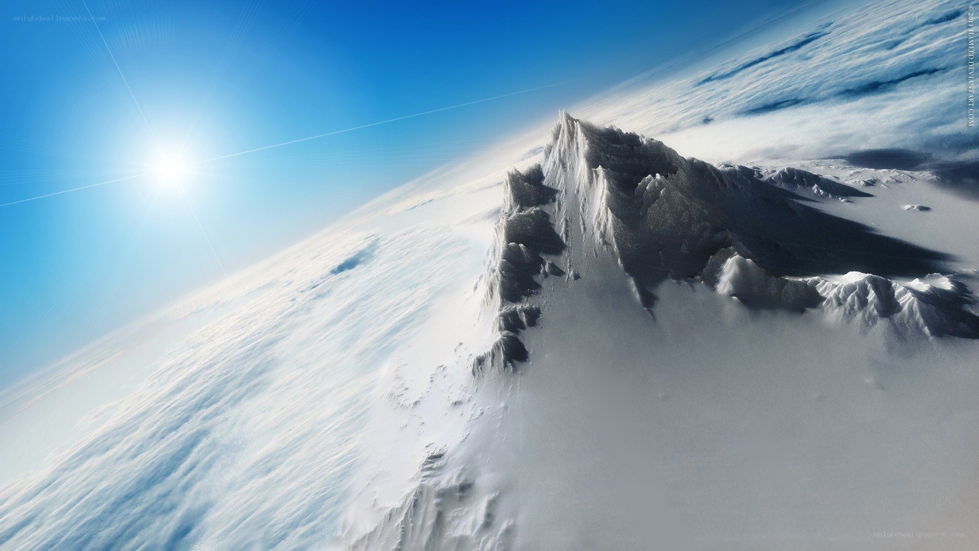 Snowy mountain peak above clouds