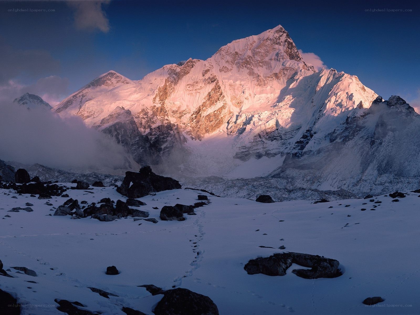 Snowy mountain peak at dawn