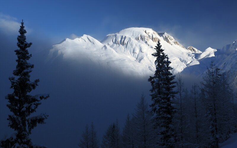 Snowy mountain peak at dawn
