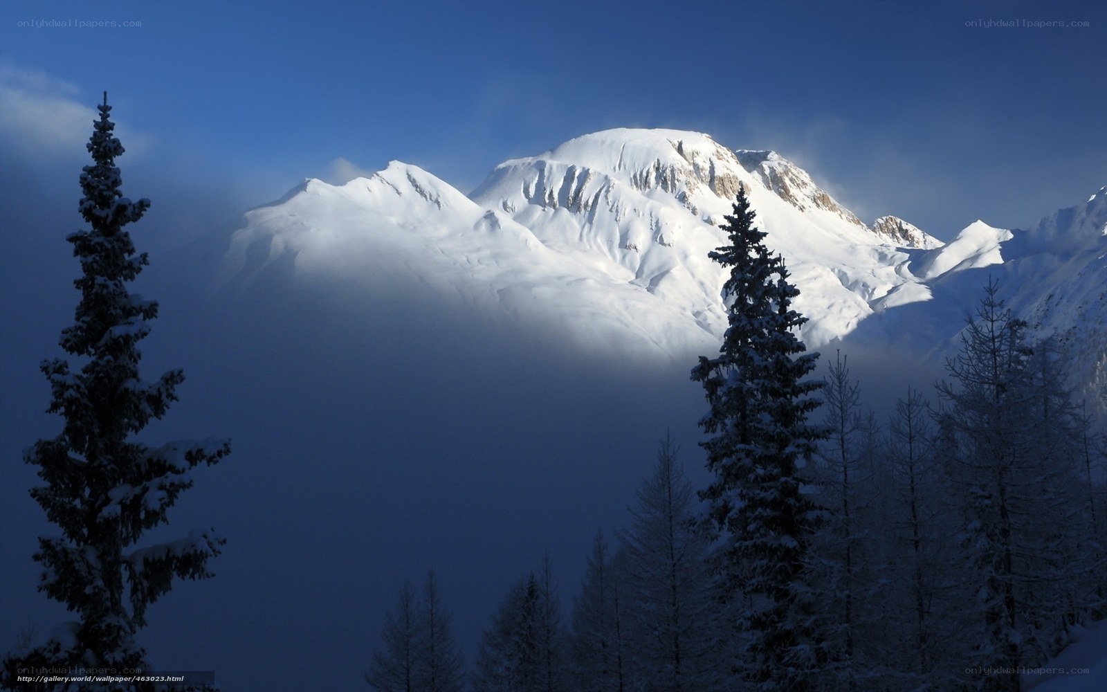 Snowy mountain peak at dawn