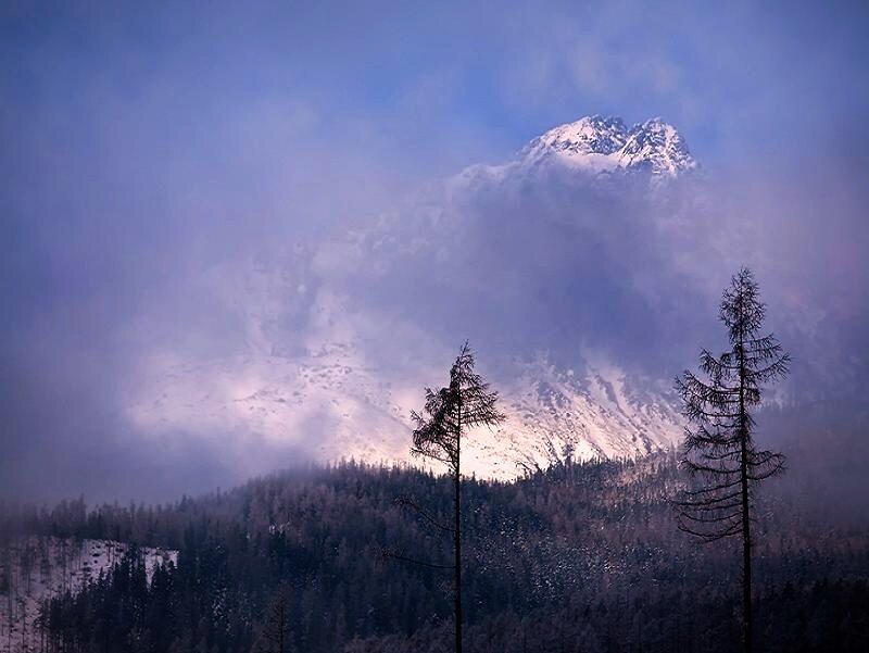 Snowy mountain peak at dusk