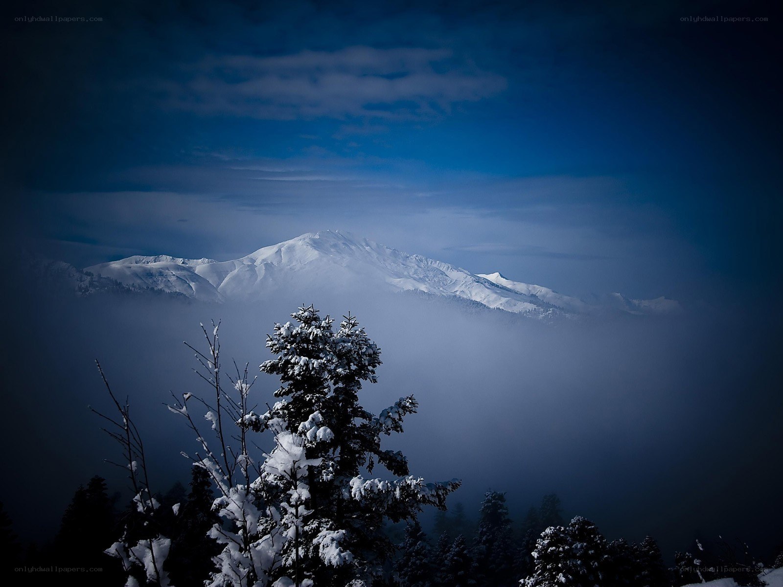 Snowy mountain peak at dusk