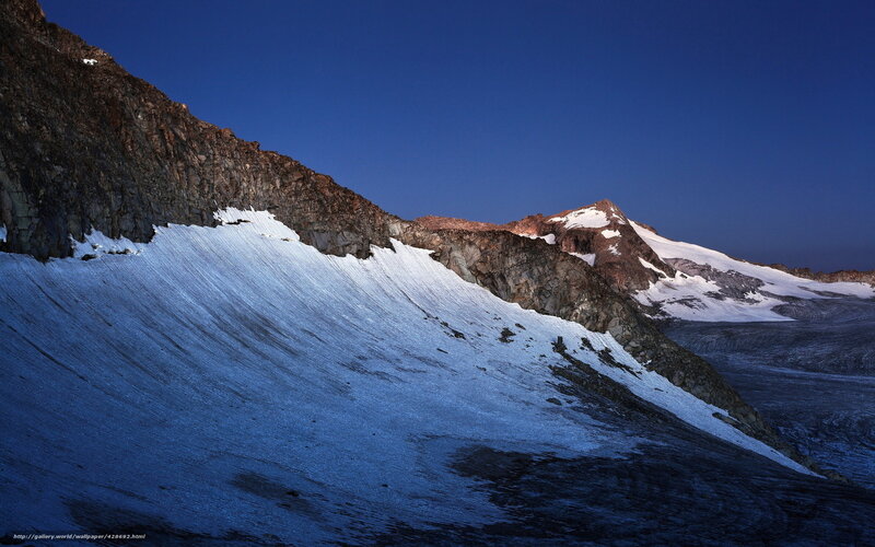 Snowy mountain peak at dusk