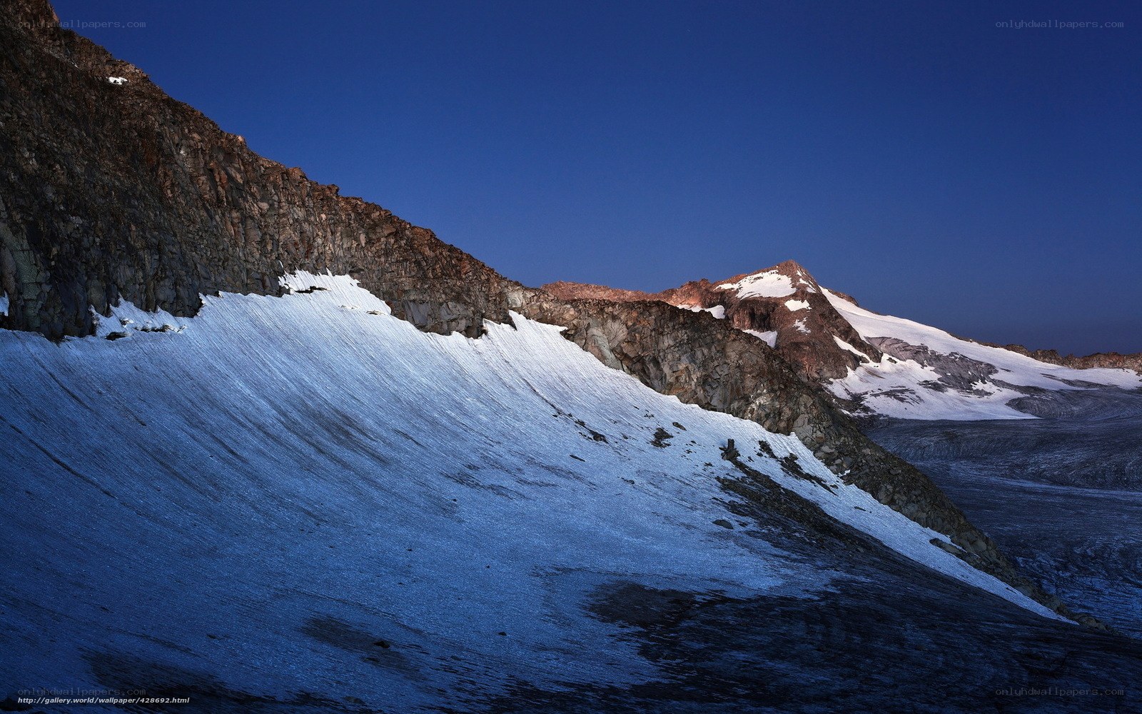 Snowy mountain peak at dusk
