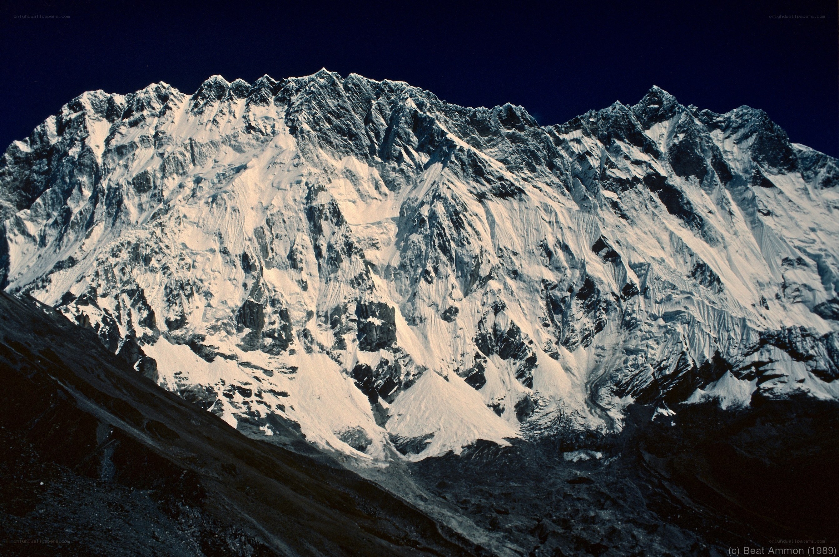 Snowy mountain peak at night