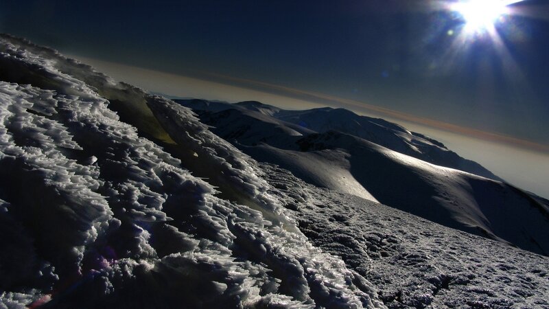 Snowy mountain peak at sunrise