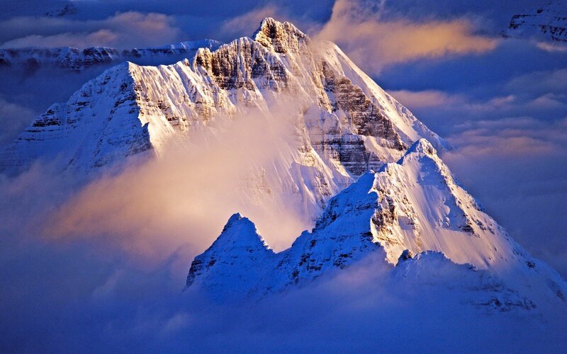 Snowy mountain peak at sunrise