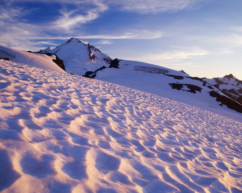 Snowy mountain peak at sunrise
