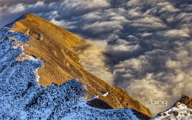 Snowy mountain peak at sunrise