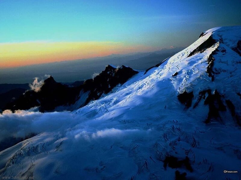 Snowy mountain peak at sunrise