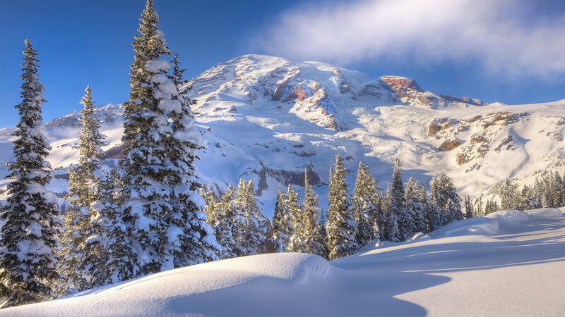 Snowy mountain peak at sunrise