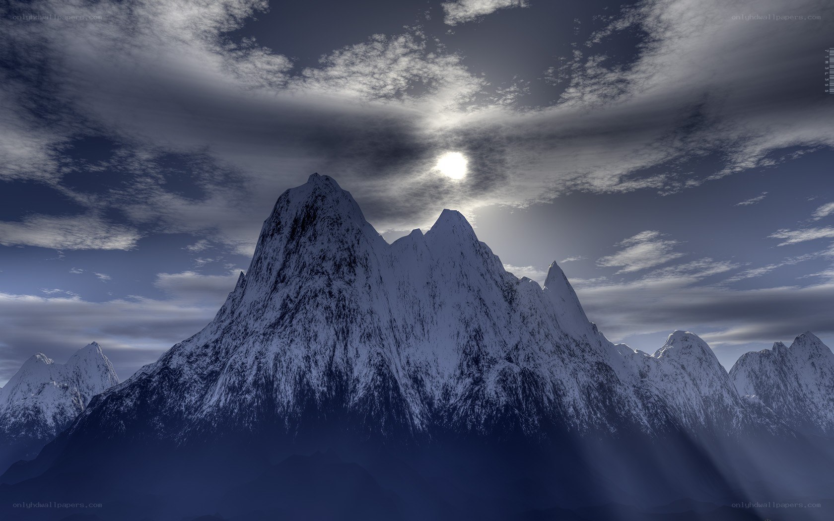 Snowy mountain peak at sunset