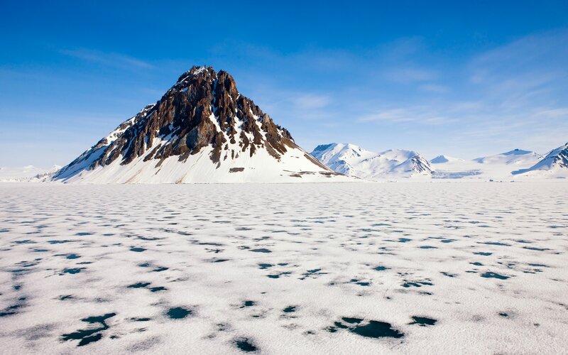 Snowy mountain peak in polar region