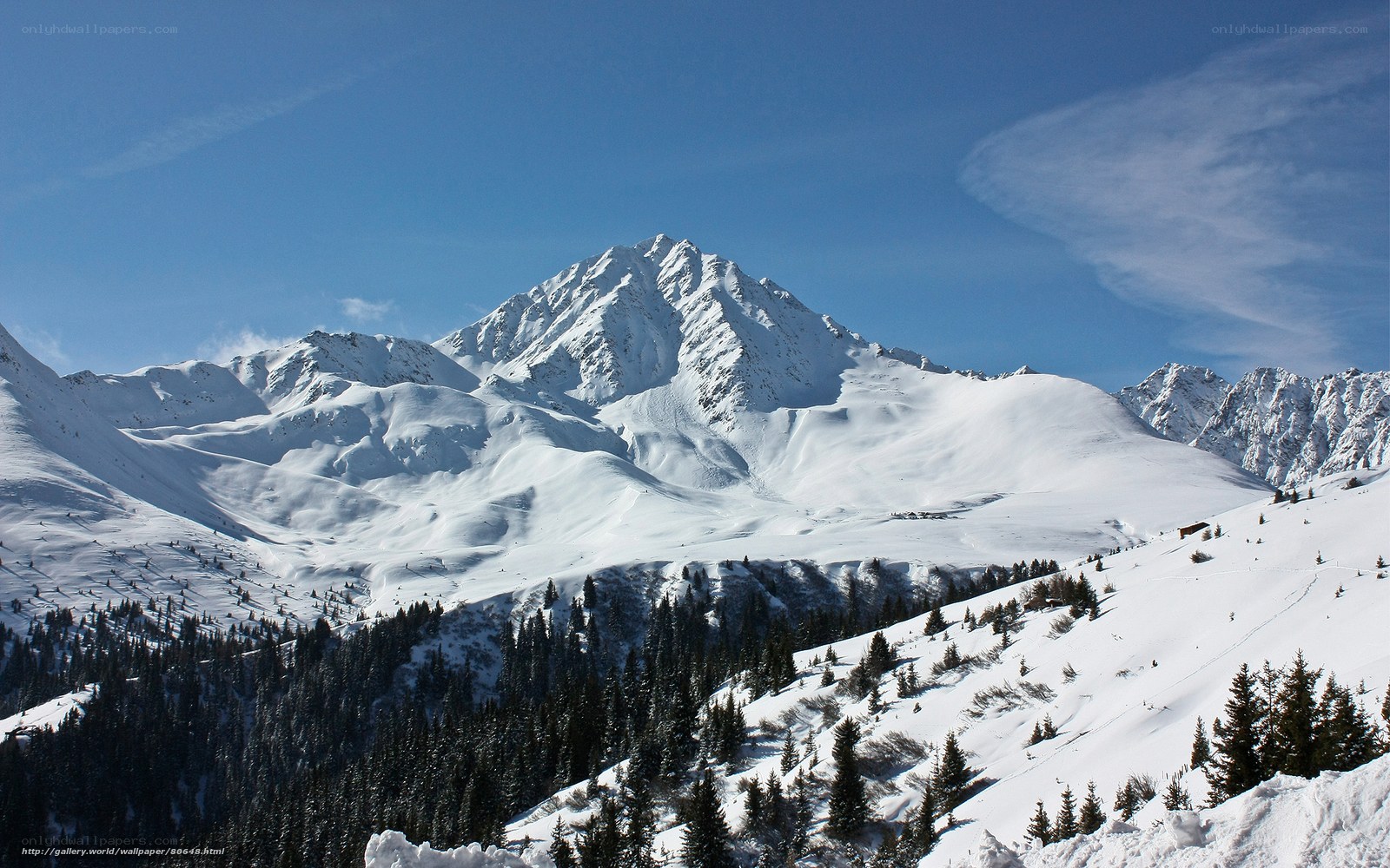 snowy mountain peak under blue sky