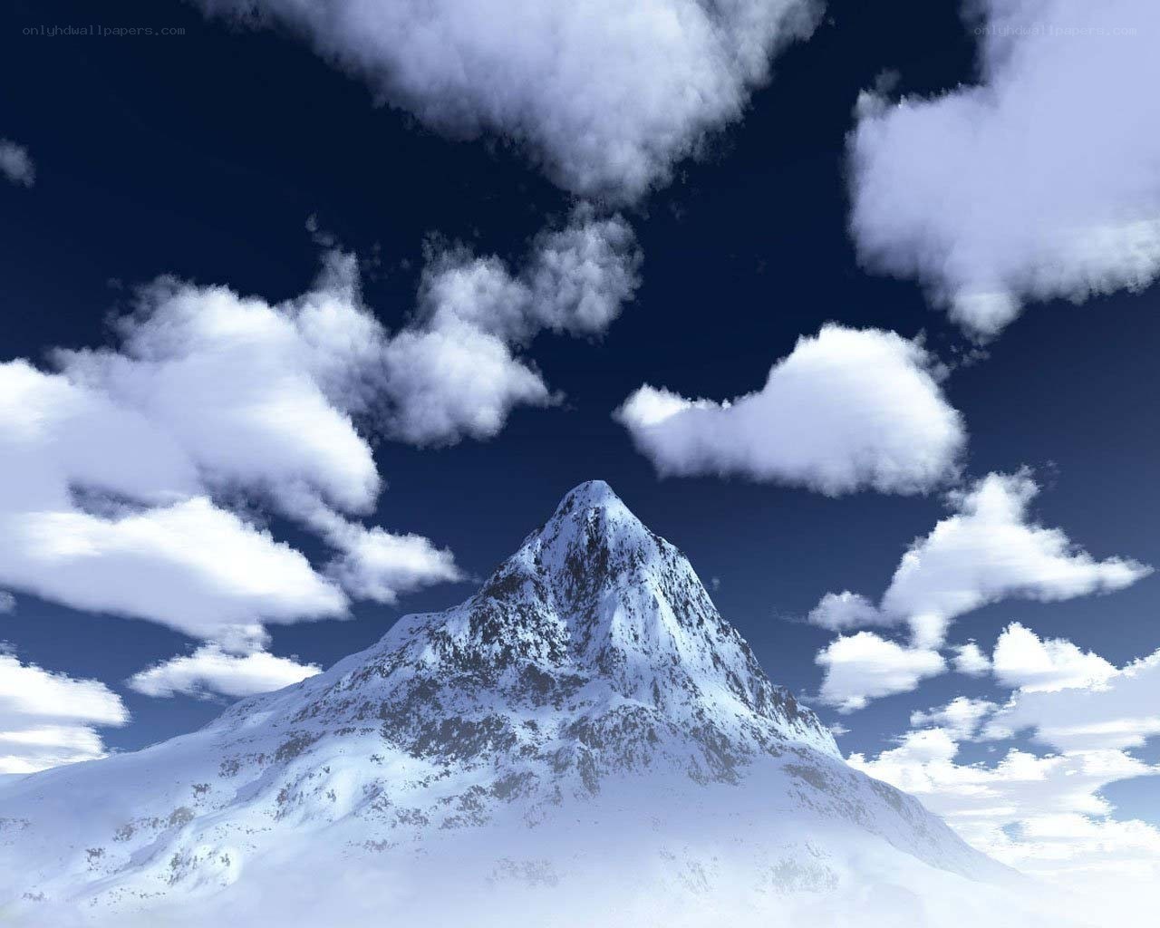 Snowy mountain peak under clouds