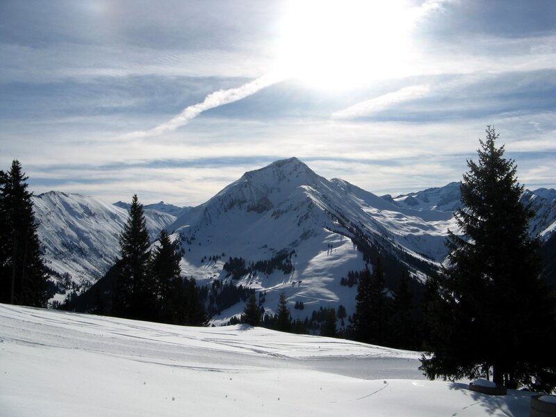 snowy mountain peak under sun