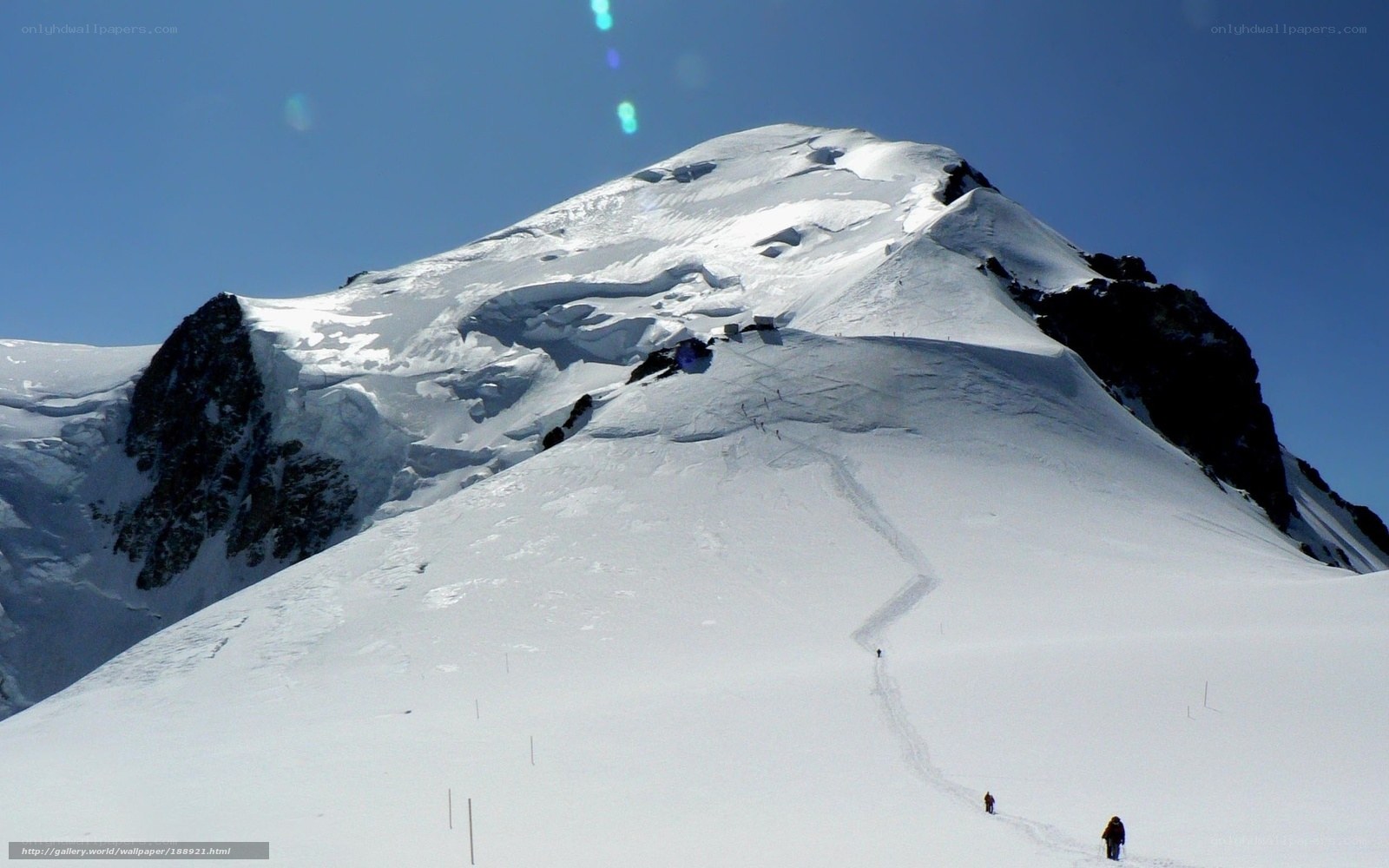 Snowy mountain peak with climbers