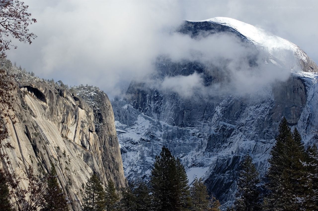 Snowy mountain peak with clouds