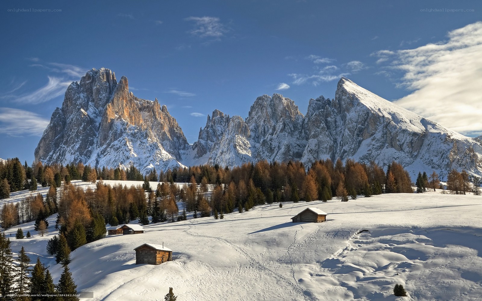 Snowy mountain peaks and cabins