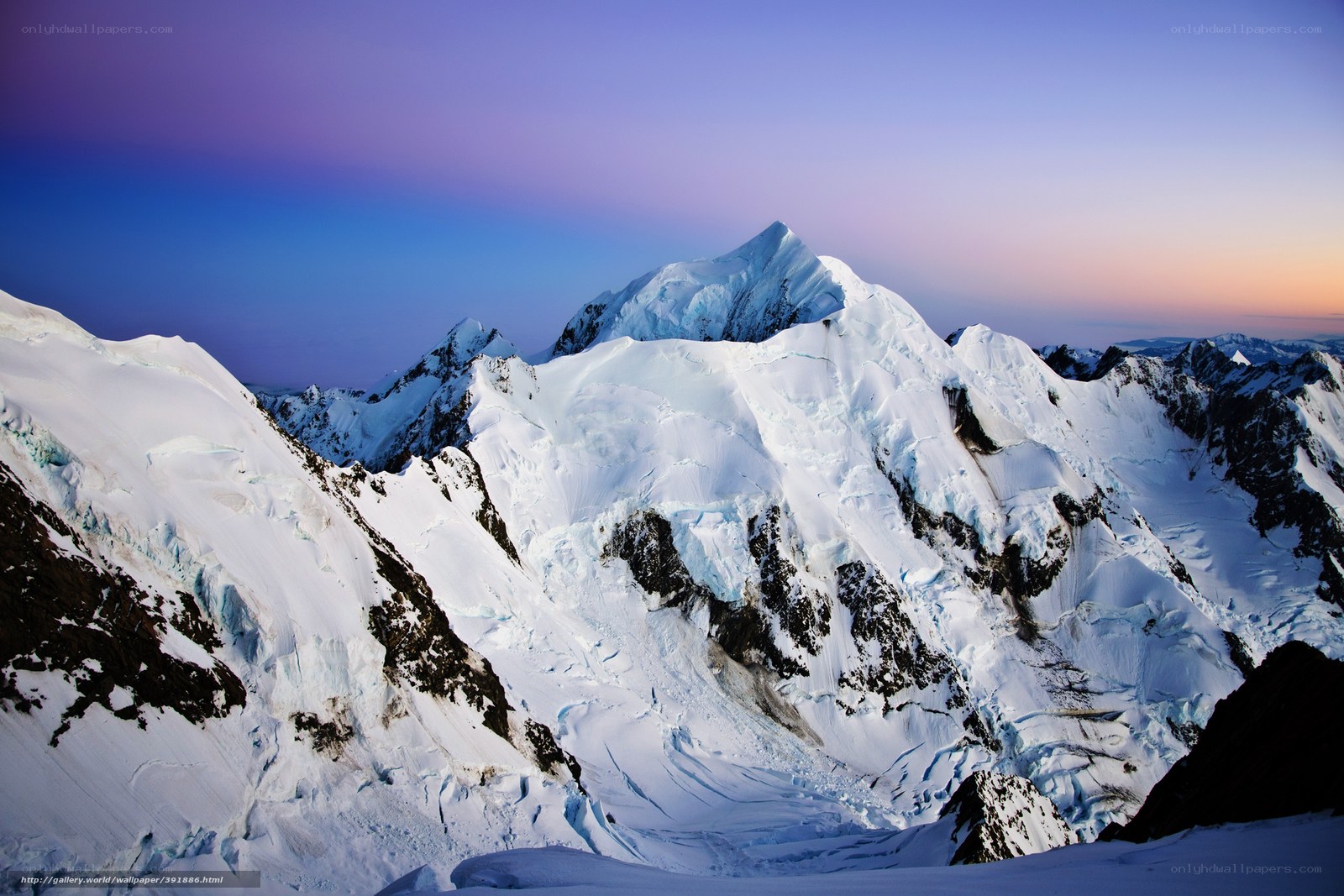 Snowy mountain peaks at dusk