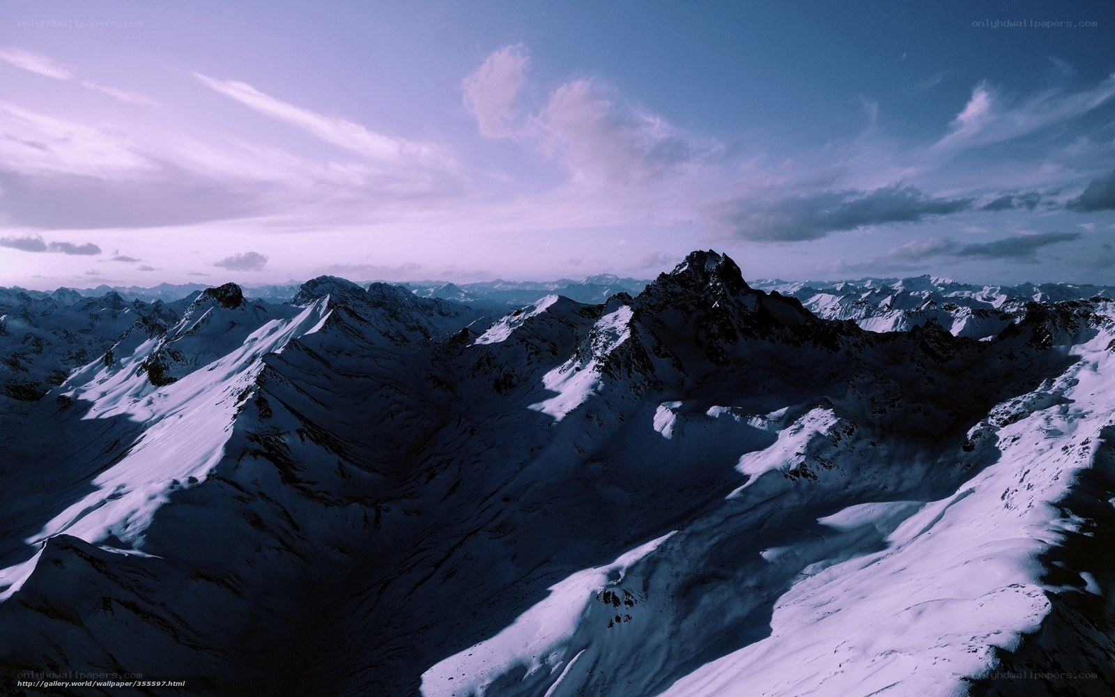 snowy mountain peaks at dusk